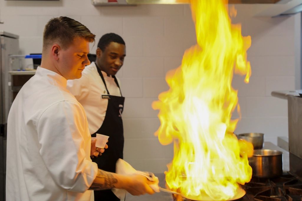 A cook working at the open kitchen